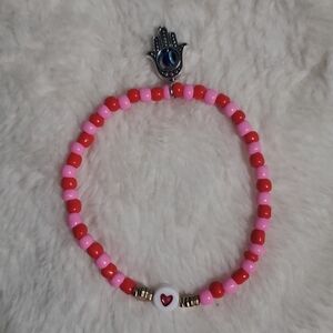 Pink and Red Beaded Bracelet with Hamsa Charm
